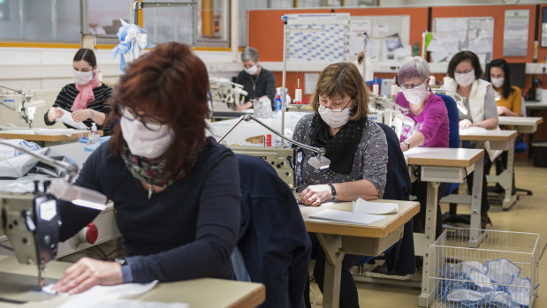 Workers with disabilities sew face masks at a workshop in Neunkirchen, Germany. 
