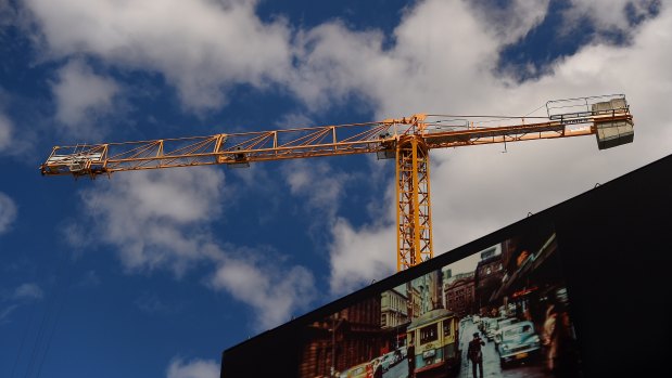 A crane works on a building site in Chippendale, Sydney