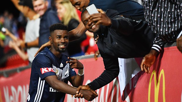 Kamsoba takes a moment with the crowd after a Victory game in Adelaide.