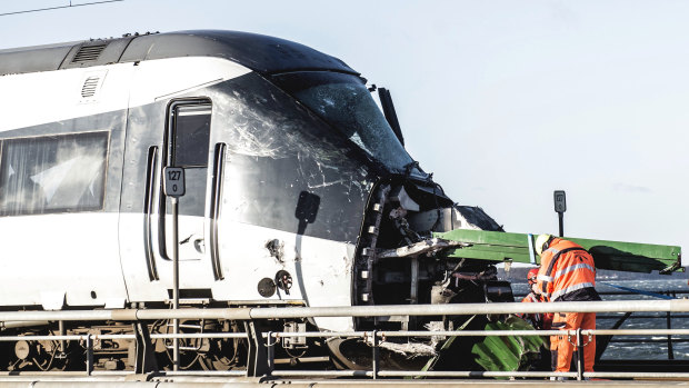 Rescue workers at the site of a train accident on Great Belt Bridge in Nyborg, in Denmark.