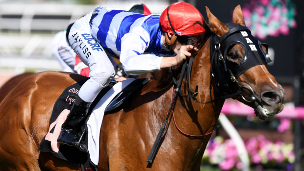 David Hayes-trained Redkirk Warrior, with Regan Bayliss aboard, wins the Black Caviar Lightning at Flemington.