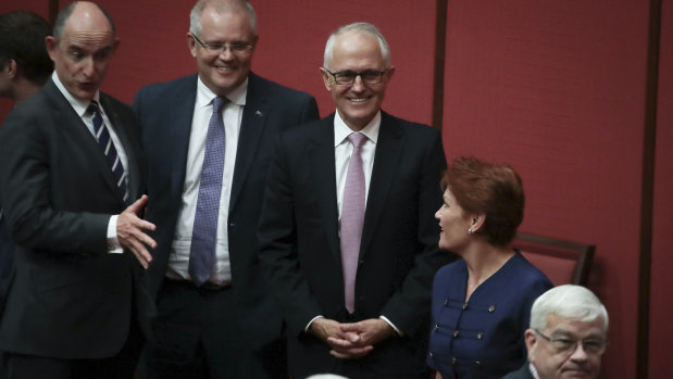 Treasurer Scott Morrison and Prime Minister Malcolm Turnbull in discussion with Pauline Hanson in the Senate in February 2018.