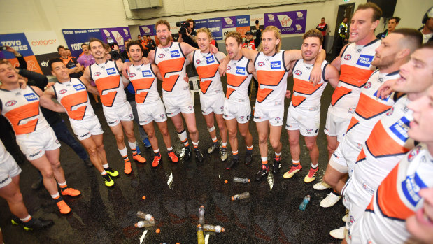 On song: The Giants belt out the club song after the win over Port Adelaide.