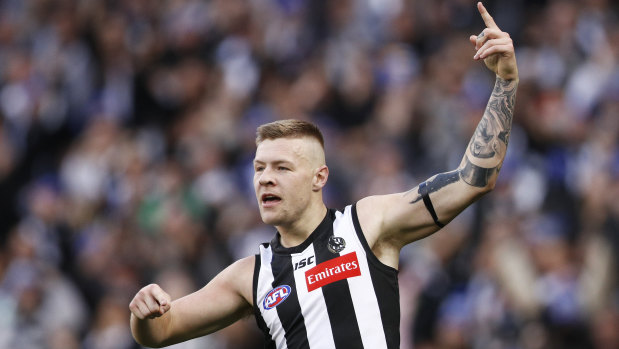 Jordan De Goey of the Magpies celebrates a goal.