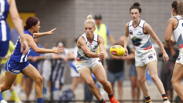 Cool in the heat: Erin Phillips offloads under pressure during the round 5 AFLW match between Adelaide and North Melbourne at Avalon Airport Oval in Melbourne.