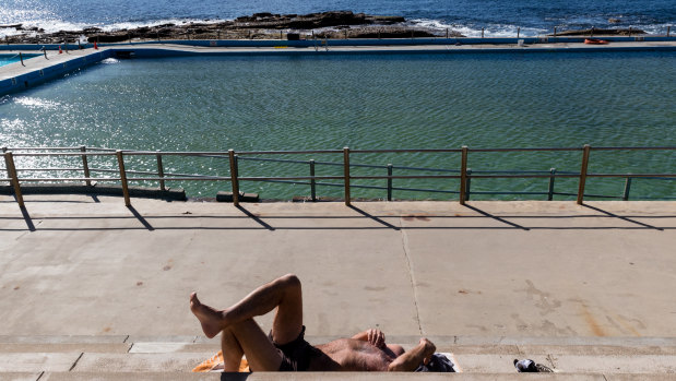 A sunseeker finds what he was looking for at Dee Why on Wednesday.
