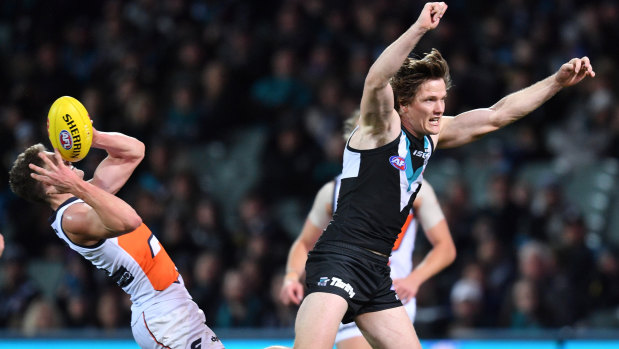 Pol position: Port's Jared Polec attempts to spoil a mark by Giant Jacob Hopper.