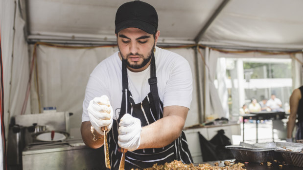 Sorial Ibraheil of the mercy association making chicken shawarma at the National Multicultural Festival last year.