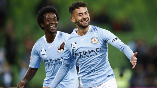 Melbourne City's 15-year-old Idrus Abdulahi (right) celebrates scoring in his A-League debut against Central Coast. 