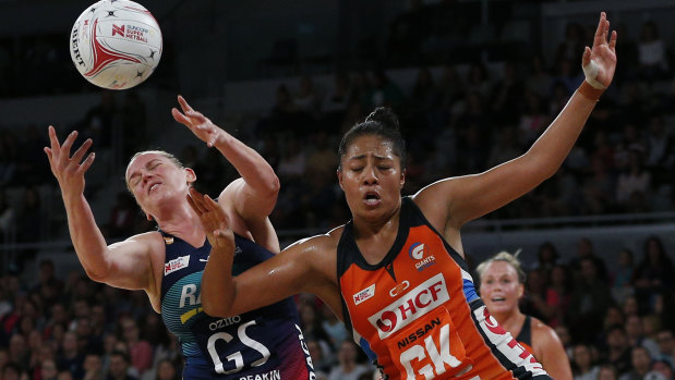 Eyes on the prize: Melbourne's Caitlin Thwaites battles for possession with Samantha Poolman of the Giants last weekend.