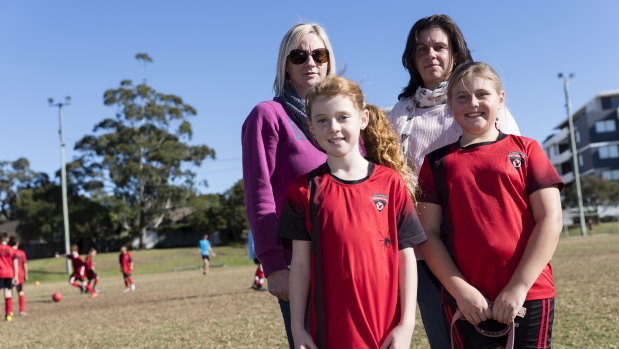 Finding car parks near sporting fields on Saturdays is a nightmare for Melinda O'Brien, back left, and Jodi Backhouse. They are pictured with their daughters Alana and Oliva, both 9, at North Caringbah Oval.