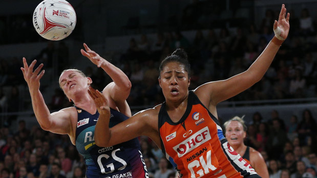 Eyes on the prize: Melbourne's Caitlin Thwaites goes up for a grab againt Samantha Poolman of the Giants.