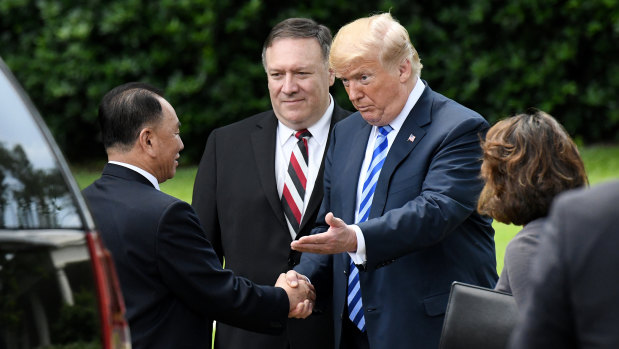 US President Donald Trump, centre right, shakes hands with Kim Yong Chol, vice chairman of North Korea's ruling Worker's Party Central Committee, next to Mike Pompeo, centre, on the South Lawn of the White House after a meeting in Washington, D.C.,