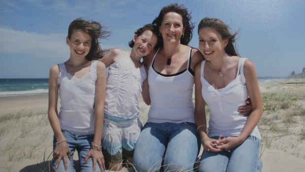 Single mum Di with her daughters (from left) Kellie, Melanie and Sarah before two severe strokes upended her life.