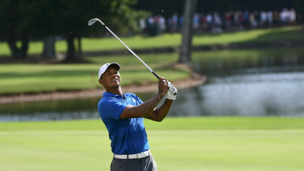 So close: Tiger Woods has a three-stroke lead heading into the final round.