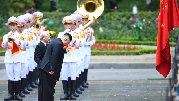 North Korean leader Kim Jong-un bows as he stands alongside Nguyen Phu Trong, Vietnam's President, during a welcoming ceremony at the Presidential Palace in Hanoi, Vietnam, on March 1, 2019. 