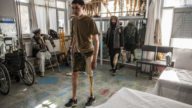An Afghan National Army soldier walks on an artificial leg at the International Committee for the Red Cross' Orthopedic Centre in Kabul.