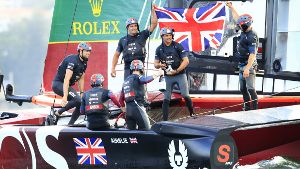 Sir Ben Ainslie, helmsman of Great Britain Sail GP Team, and his crew celebrate victory on Sydney Harbour.