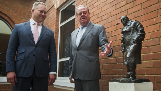 Abode Group general manager Rien Donkin and Sir Winston Churchill's grandson Jeremy Soames with a bronze sculpture of the former UK prime minister, which has been permanently loaned to West Block Hotel owners Geocon.