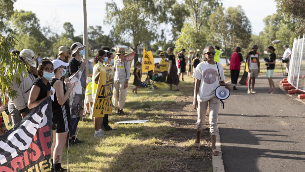 Protesters led by the Gamilaraay Next Generation Indigenous action group chant outside the Super Rugby trial match between the NSW Waratahs and the Queensland Reds.