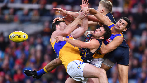 Eagles and Crows players contest the ball in their Round 10 clash.