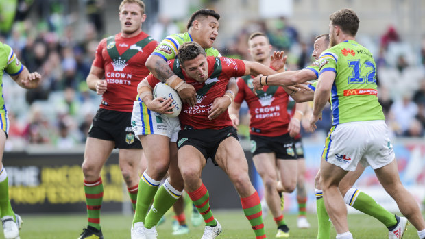 Playing through pain: Sam Burgess in action against the Raiders.