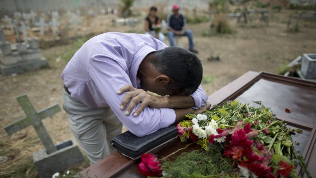 Weeping relatives arrived at the Valencia central cemetery on Friday carrying the caskets of many of the 68 victims who were killed in the fire.