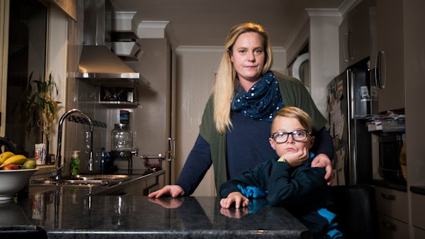 Renee Creech with her son Cody, 9, who was eating two-minute noodles when he accidentally burnt 15 per cent of his body. 