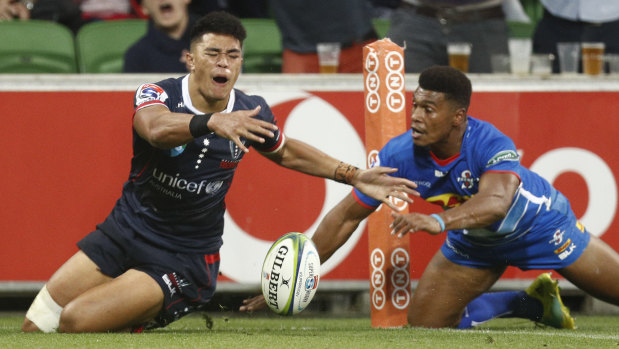 The Rebels' Semisi Tupou and the Stormers' Damian Willemse vie for the ball.