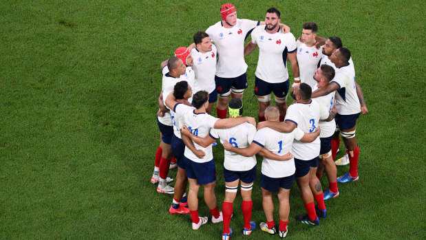 French players huddle ahead of the World Cup opener against New Zealand.