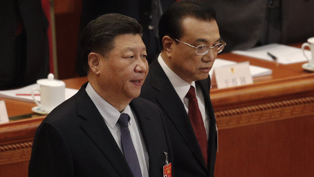 Chinese President Xi Jinping, left, and Chinese Premier Li Keqiang arrive at the opening session of China's National People's Congress last week.