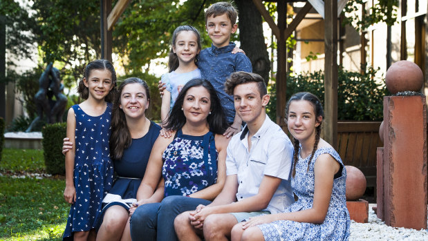 Kate Seselja (front row, centre) with children (from left) Hope, 9, Isabelle, 15, Zoe, 5, Jonah, 8, Ethan, 17, and Lily, 13.