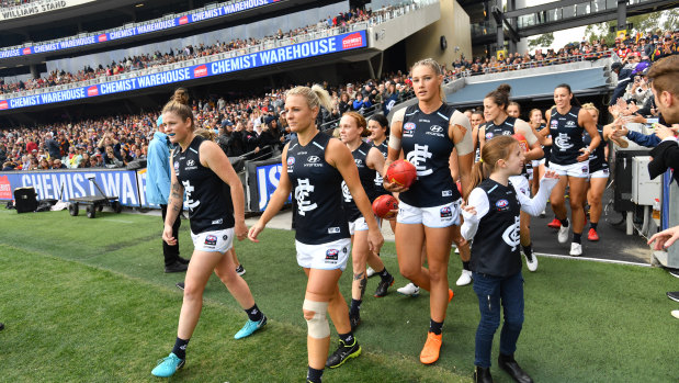 Hopes and dreams: The Blues are greeted by a league record crowd as they walk out on to the field at Adelaide Oval.