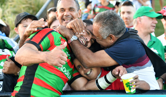 That's my boy! Souths star Cody Walker is embraced by his father Bernie after his big day on the Sunshine Coast.