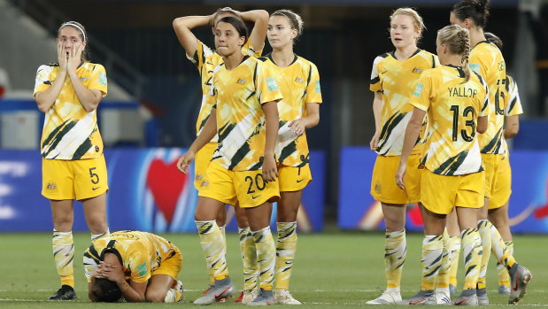 Hurting: The Matildas react after losing the penalty shootout to Norway.
