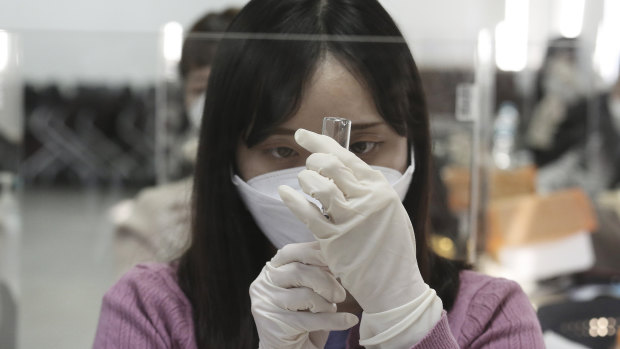 A medical worker attends a training session to learn how to give coronavirus vaccine shots at the Korean Nurses Association in Seoul. 