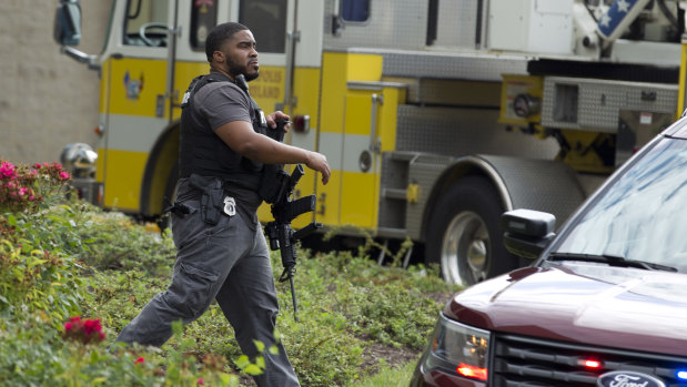 Maryland police officers patrol the area after multiple people were shot at a newspaper in Annapolis, Maryland.