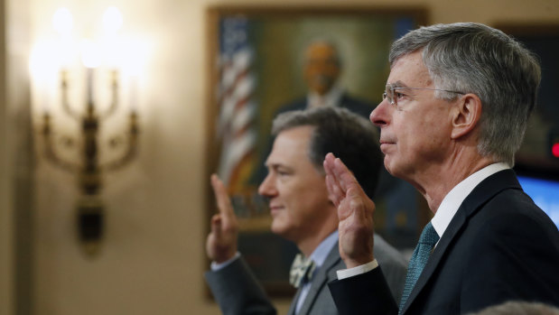 Top US diplomat in Ukraine William Taylor, right, and career Foreign Service officer George Kent, left, are sworn in to testify at the first public impeachment hearings into President Donald Trump this week. 
