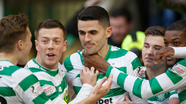 Club vs country: Tom Rogic (centre) is disappointed he will miss Celtic's clash with Rangers.
