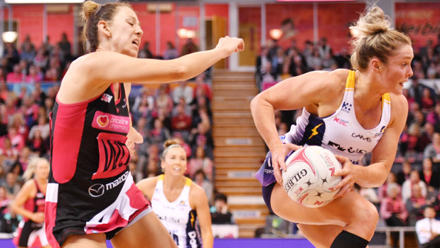Fiona Fowler (left) of the Thunderbirds and Laura Scherian of the Lightning during the round 12 Super Netball match at Priceline Stadium in Adelaide on Sunday.