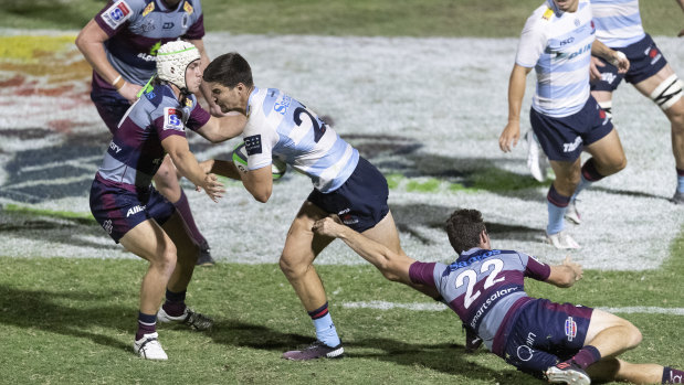 NSW’s Jack Maddocks takes the ball into the Queensland defence during their trial match in Narrabri on Friday night.