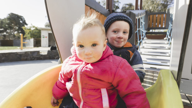 Elliot Banyer, 2, and his sister, Josie, 10 months. Elliot loves playing in the sand, while Josie likes going down the slide. 