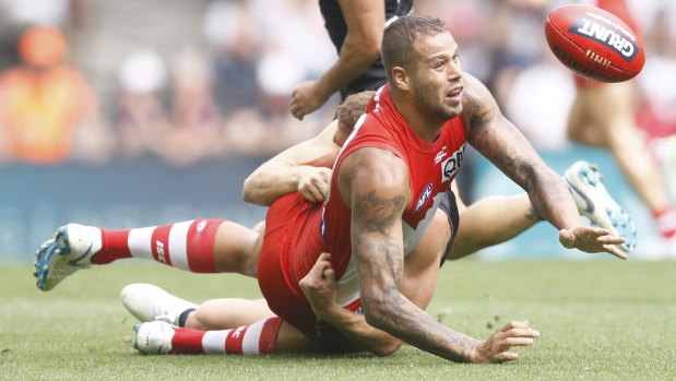 Star turn: Lance Franklin gets a handpass away against the Blues.