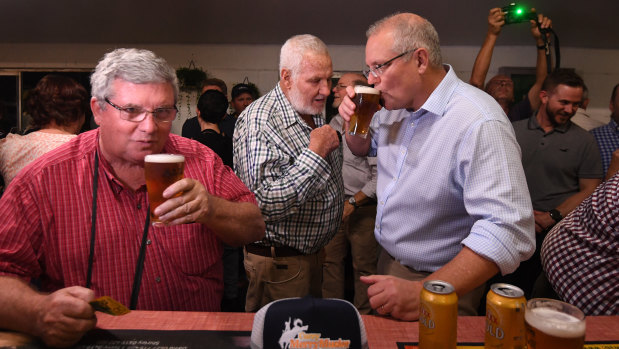 Shane Stone, left, has a beer with Prime Minister Scott Morrison in Cloncurry the week after the May 2019 election.
