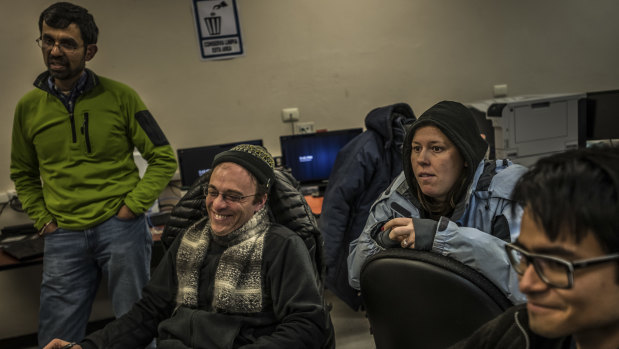Astronomer Sheperd Doeleman, second from left, watches data being received inside the control room for Mexico's Large Millimetre Telescope.
