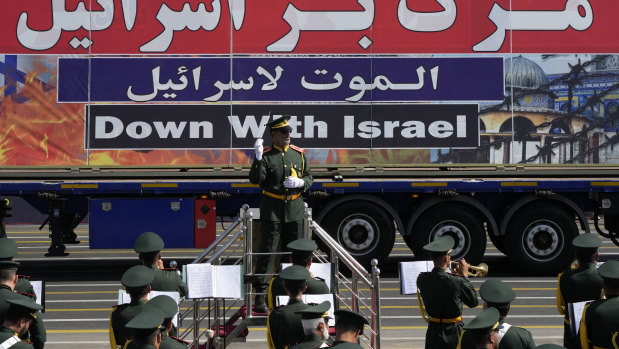 An anti-Israel banner is carried on a truck iniin an annual military parade in September in front of the shrine of the late revolutionary founder Ayatollah Khomeini, just outside Tehran, Iran.