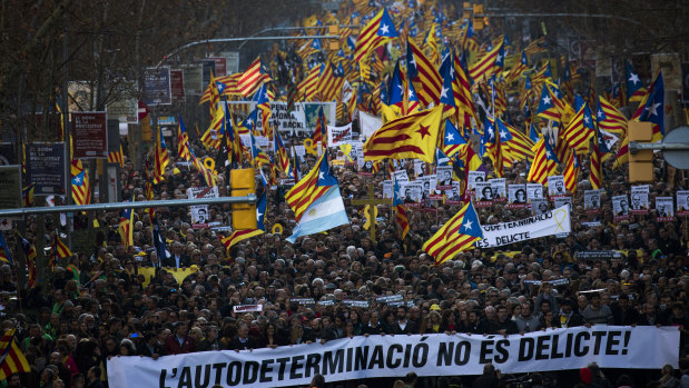 Independence demonstrators wave esteladas or independence flags during a demonstration supporting the imprisoned pro-independence political leaders in Barcelona on Saturday.
