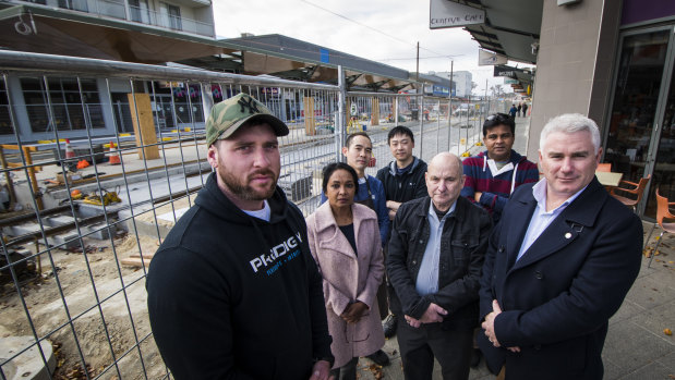 Canberra Liberal James Milligan (right) will next week call for an independent inquiry into the financial impact of light rail construction on Gungahlin businesses. Pictured with business owners Cam McAlister from Prodigy, Radhika Reddy of Gungahlin Sultans Turkish Cuisine, Gary Woo of G tree Cafe, Tang Jong from Asian Tea House, Allan Russell from Diamond Ring Designs and Raj Karingula from Sultans Turkish Cuisine.