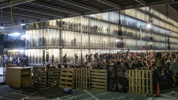 Protesters use makeshift barricades during a demonstration at El Prat airport, outskirts of Barcelona.