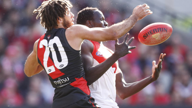 Zac Clarke of the Bombers and Aliir Aliir of the Swans contest the ball in round 16.
